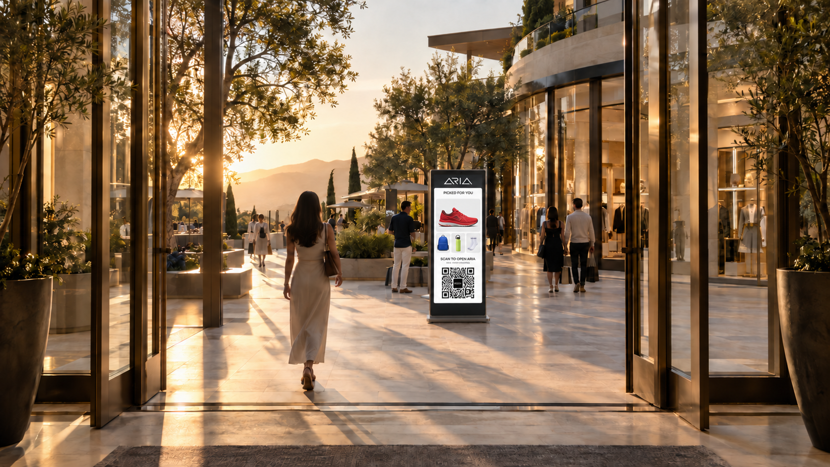ARIA kiosk with a red running shoe and sports accessories in a sunlit glass mall entrance